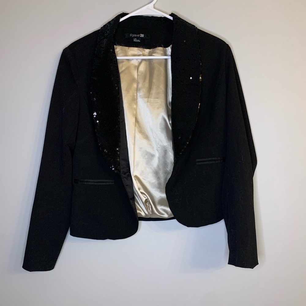Black Women’s blazer with sequin lapels.
